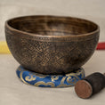 Load image into Gallery viewer, Antique style engraved Singing Bowl with dark aged finish, blue cushion and wooden mallet