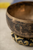 Load image into Gallery viewer, Handmade Kopre singing bowl from Nepal with mallet and cushion”