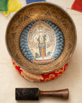 Load image into Gallery viewer, 1000 Arms Compassionate Buddha Singing Bowl for Third Eye Chakra with red cushion and wooden mallet
