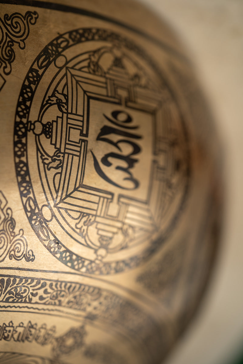 Four-Armed Chenrezig Carved Singing Bowl - Handcrafted Tibetan Bowl