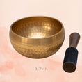 Load image into Gallery viewer, Hand Hammered Singing Bowl with dotted finish, shown held by a woman outdoors