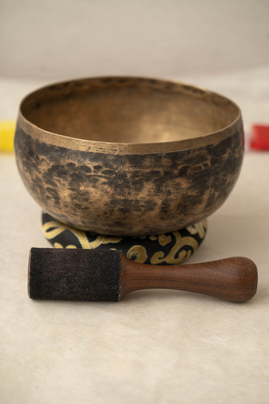 “Handcrafted Kopre singing bowl from Nepal with natural metal finish”