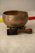 Load image into Gallery viewer, Handcrafted Kopre singing bowl supporting crown chakra alignment

