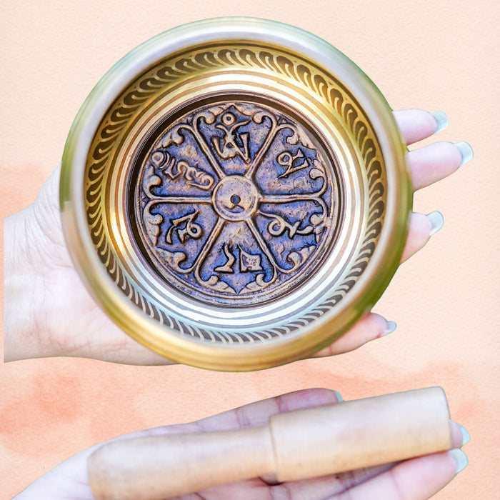 Compassionate Mantra Singing Bowl with engraved mantra design, polished brass finish and wooden mallet.