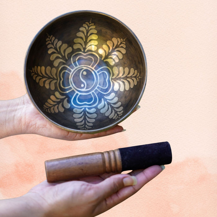 Harmony Yin Yang Singing Bowl with floral mandala design, dark aged brass interior and wooden mallet.