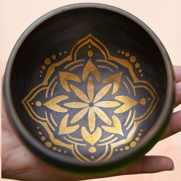 Hamsa Singing Bowl with a detailed Hamsa hand design inside, featuring a dark interior with golden artwork.