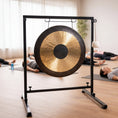 Load image into Gallery viewer, Gong on a stand in a room with wooden floor and decor
